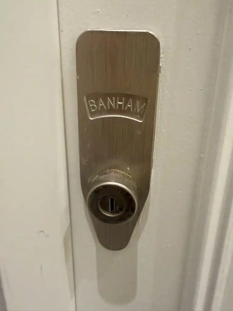 Banham branded high security lock fitted on white front door